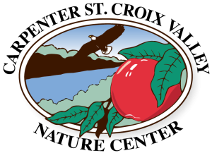 logo for Carpenter St. Croix Valley Nature Center shows bald eagle soaring over a river with red ripe apple in the foreground.